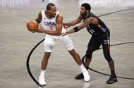 Kawhi Leonard #2 of the LA Clippers dribbles against Kyrie Irving #11 of the Brooklyn Nets.